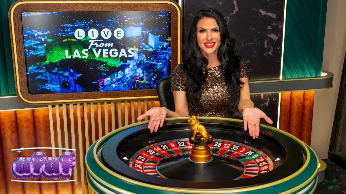 Suasana meja kasino live dealer dengan dealer profesional yang siap melayani pemain secara daring.